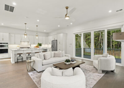 Interior staged living room and kitchen of 1167 Guerins Bridge in Awendaw, SC by Grantham Homes