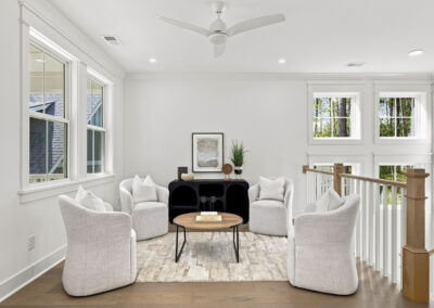 Interior staged second story loft of 1167 Guerins Bridge in Awendaw, SC by Grantham Homes