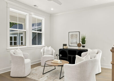 Interior staged second story loft of 1167 Guerins Bridge in Awendaw, SC by Grantham Homes