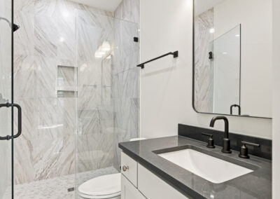 Interior second story bathroom and shower of 1167 Guerins Bridge in Awendaw, SC by Grantham Homes
