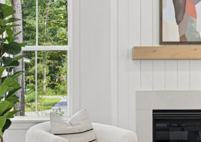 Closeup detail of fireplace mantle and shiplap in living room of 1167 Guerins Bridge in Awendaw, SC by Grantham Homes