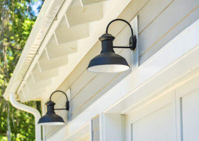 Gooseneck lighting over top of the garage doors of 1296 Venning Road in Mount Pleasant, SC